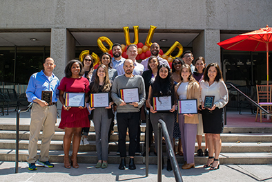 Law award winners posing in front of the law school