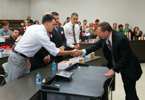 Military vets receive handshakes from Gen. Petraeus