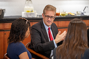 Dean Guzman with undergraduate students