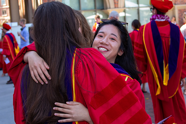 JD grads hugging