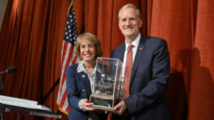 USC President Carol L. Folt presents the provost’s chair to Andrew T. Guzman. (USC Photo/Gus Ruelas)