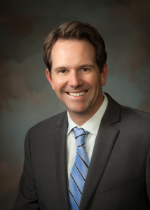 A headshot of law professor Jay Anstine